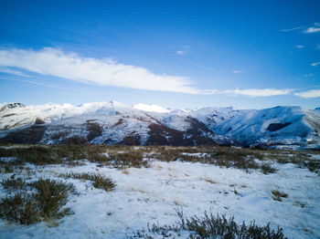 Scenic view of snowcapped mountains against sky