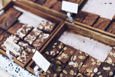 High angle view of chocolate brownies for sale at bakery