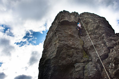 Low angle view of rock against sky