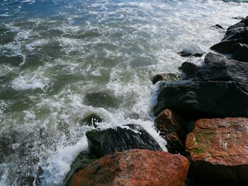 Sea waves splashing on rocks
