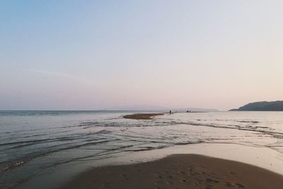 Scenic view of beach against clear sky