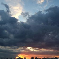 Low angle view of dramatic sky during sunset