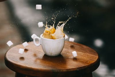 Close-up of coffee splashing on table