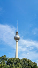 Low angle view of communications tower against sky