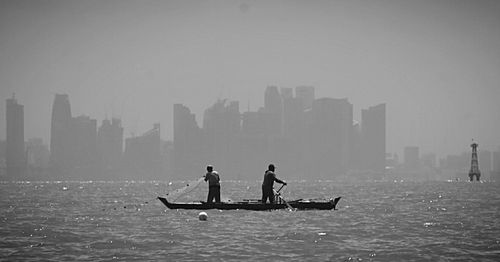 City lit up at waterfront