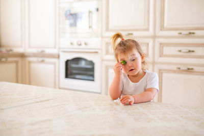 Cute girl sitting at home