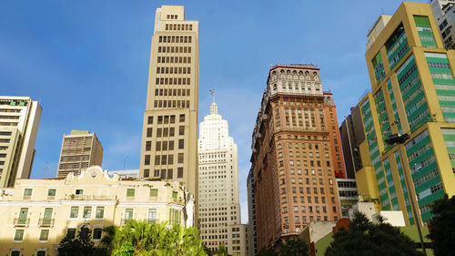 Low angle view of modern buildings against clear sky