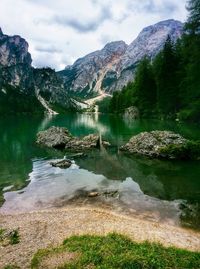 Scenic reflection of rocky landscape in calm lake