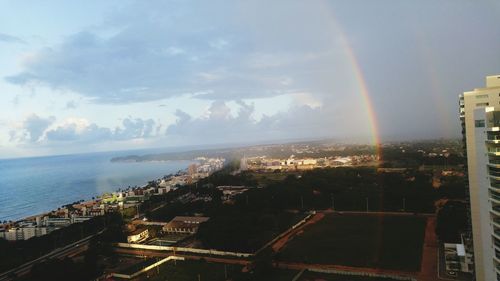 High angle view of city against cloudy sky