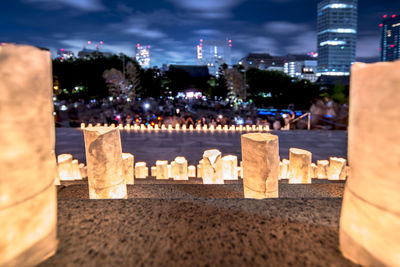 Handmade japanese paper washi lanterns illuminating the stone steps of the zojoji temple.