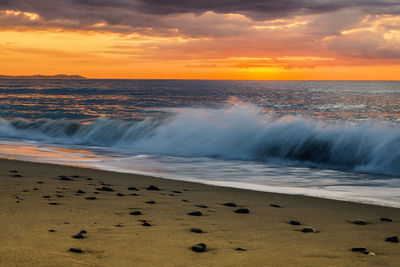 Scenic view of sea against sky during sunset