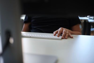 Close-up of man working on table