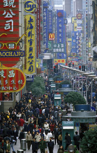 High angle view of people on street market in city