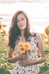 Portrait of a smiling young woman standing outdoors