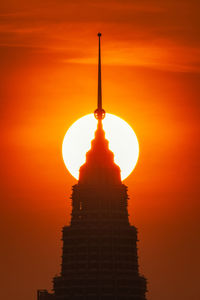 Low angle view of building against sky during sunset