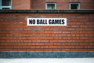 Information sign on brick wall