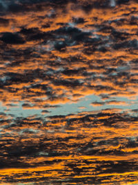 Low angle view of dramatic sky during sunset