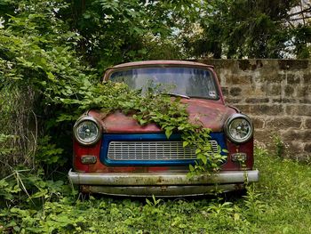 Abandoned car on field