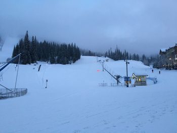 Scenic view of snow covered landscape against sky