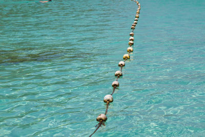 High angle view of chain in sea