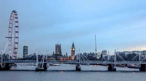 Bridge over river with buildings in background