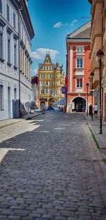 Road amidst buildings in city