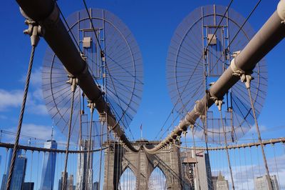 Brooklyn bridge against blue sky