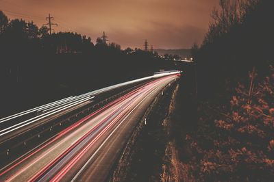 High angle view of light trails on road in city