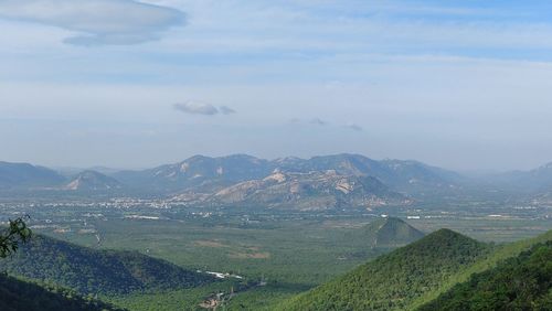 Scenic view of landscape and mountains against sky