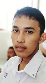 Close-up portrait of teenage boy at high school
