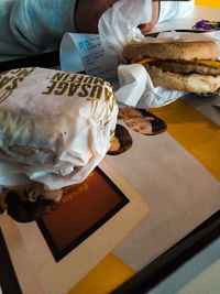 High angle view of woman holding food at home