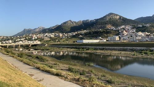 Scenic view of lake and mountains against clear sky tetouan city