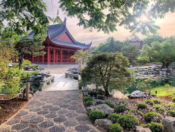 Temple by building against sky