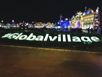 Information sign in city at night