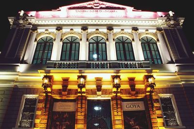 Low angle view of illuminated building at night