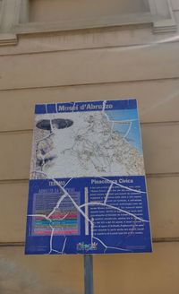 Close-up of information sign on wall