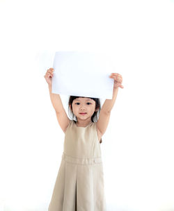 Portrait of a girl holding camera over white background