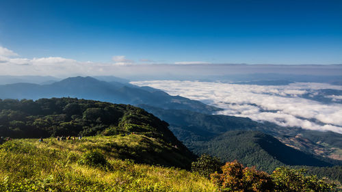 Scenic view of mountains against blue sky