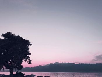 Scenic view of silhouette mountains against sky during sunset