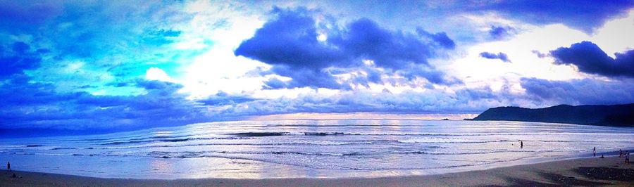 Scenic view of sea against blue sky