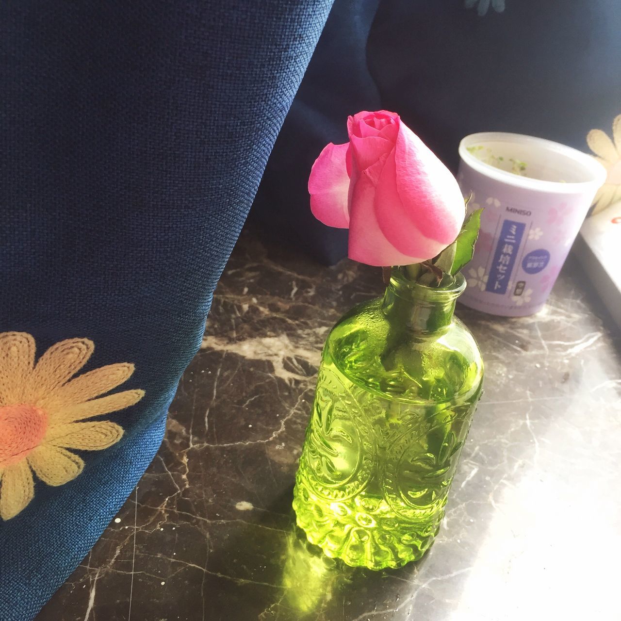 freshness, flower, table, indoors, still life, high angle view, close-up, food and drink, vase, pink color, petal, leaf, drink, fragility, glass - material, no people, refreshment, drinking glass, potted plant, flower head