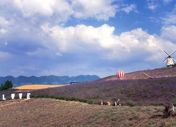 Scenic view of mountains against cloudy sky