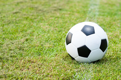 Close-up of soccer ball on grass