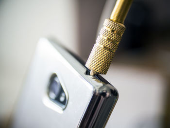 Close-up of headphones connected to smart phone