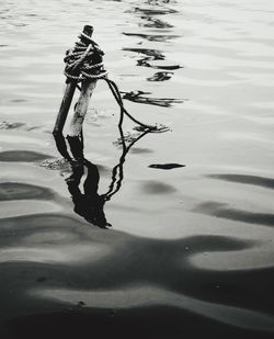 Reflection of man in lake