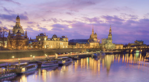 Illuminated city at waterfront