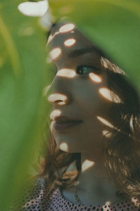 Close-up of young woman looking away