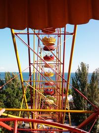 Amusement park ride against sky