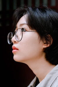 Close-up portrait of woman with eyeglasses