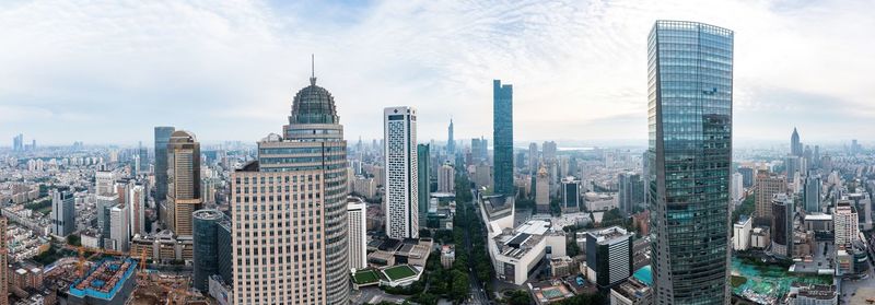 Modern buildings in city against sky